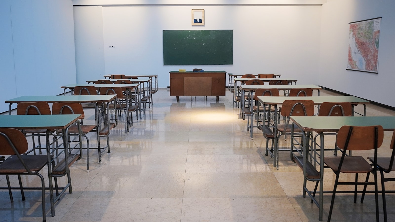Classroom with desks and blackboard — school management in Tanzania